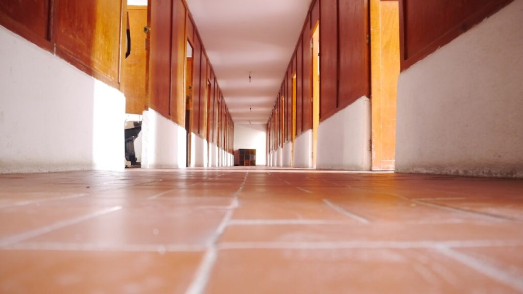 Commercial VCT flooring installation in an institutional hallway